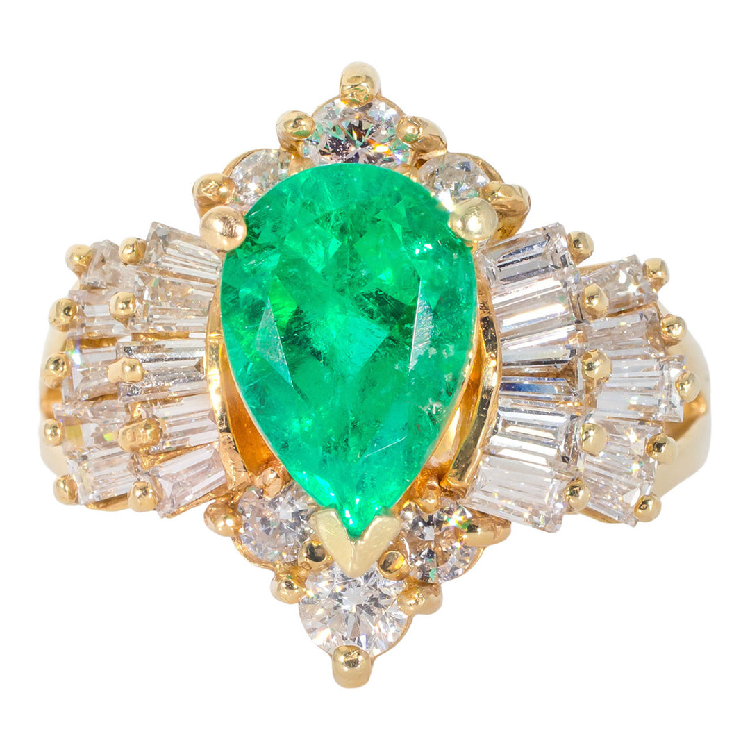 Ring in 14K YG with prong set round and baguette diamonds, and prong set emerald center stone.  D1.43ct.t.w.  Emerald 1.83ct.