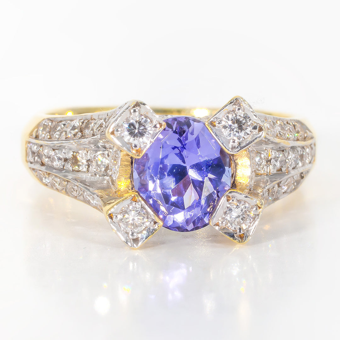 Ring in 18K YG with pave set round diamonds and prong set tanzanite center stone.  D0.75ct.t.w.  Tanzanite 1.48ct.