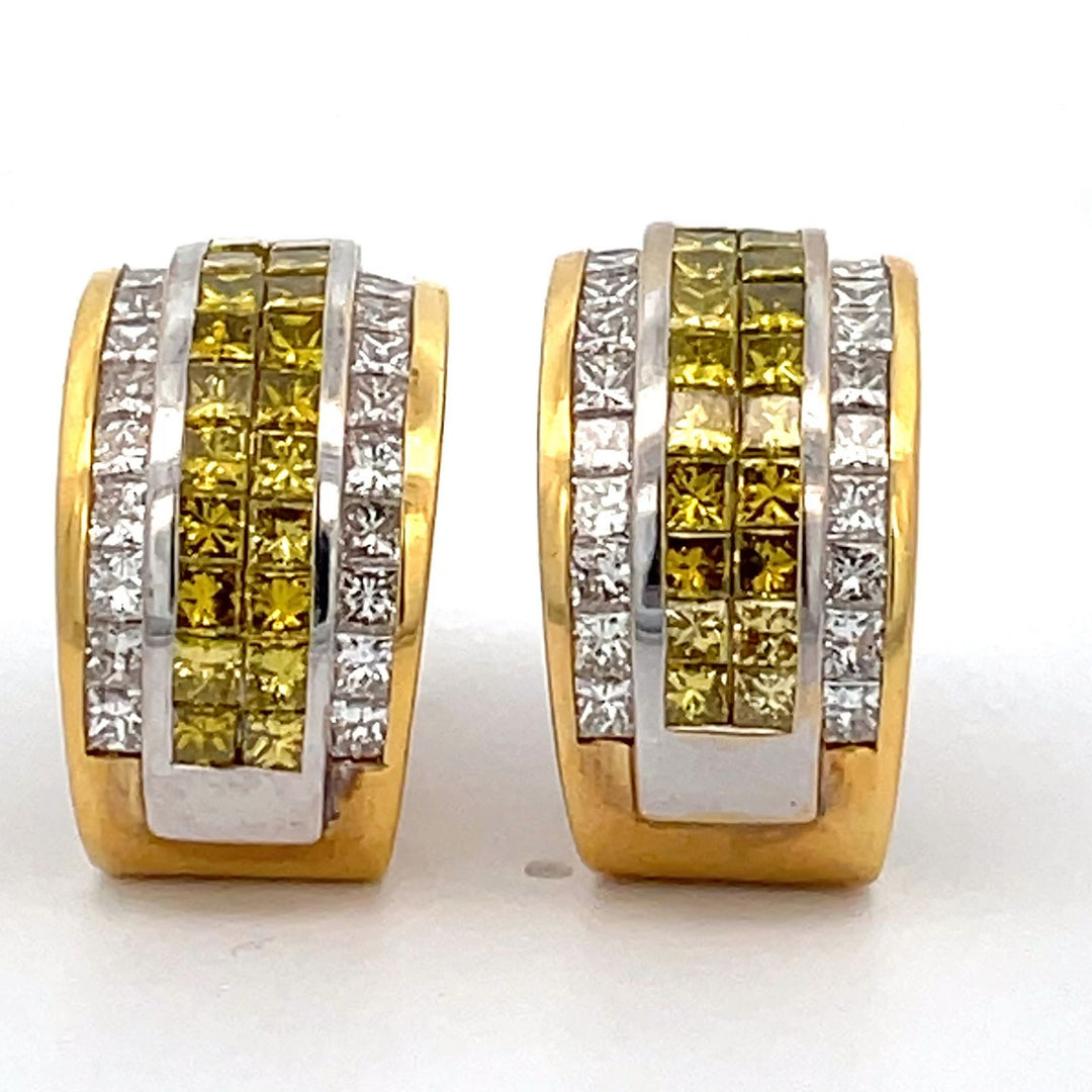 French clip earrings in 18K YG with channel set princess cuts & 2-row invisible set irradiated fancy yellow princess cut diamonds.  D5.40ct.t.w.