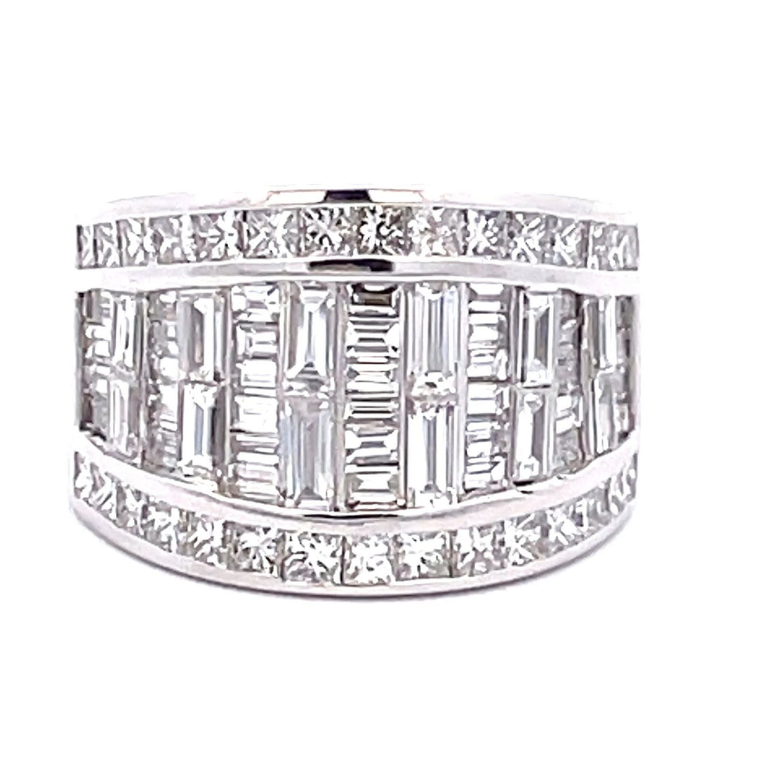 Band in 10L WG invisible set baguettes and channel set princess cut diamonds on the sides.  D3.68ct.t.w.  Size 5.5