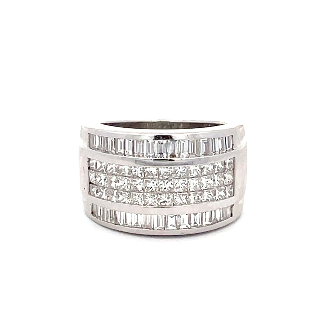 Band with 3-row invisible set princess cuts on the center  & channel set baguette diamonds on the sides.  D2.69ct.t.w.  Size 6.25