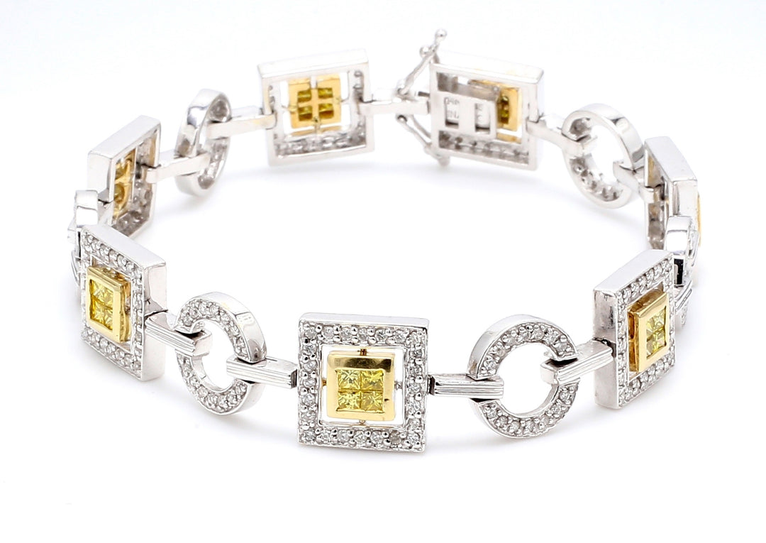 7"" Link bracelet in 2-tone with round & alternating 2x2 princess cut diamonds.  D3.10ct.t.w.