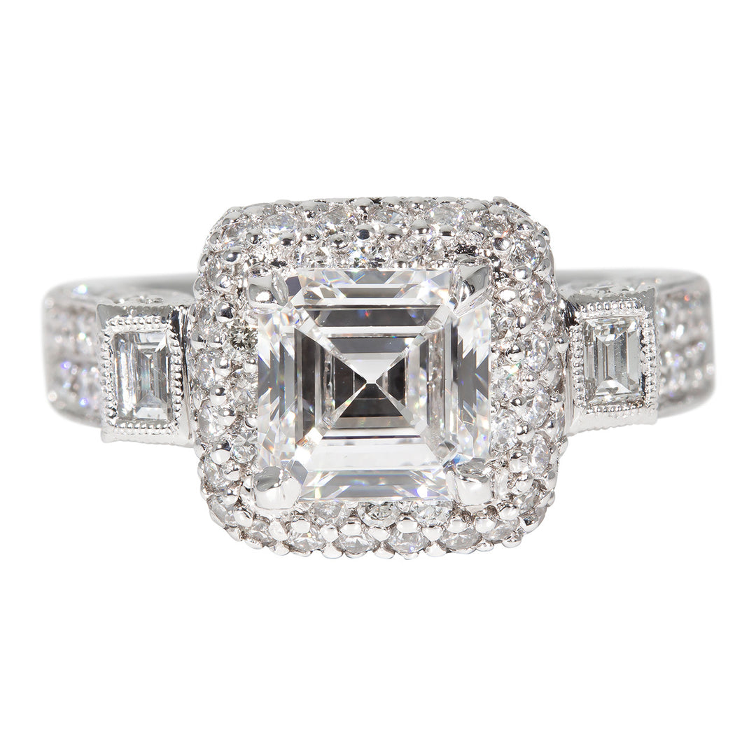 Art-deco halo semi-mount in platinum with bezel set baguettes and pave set round diamonds.  D1.55ct.t.w.  Size 6