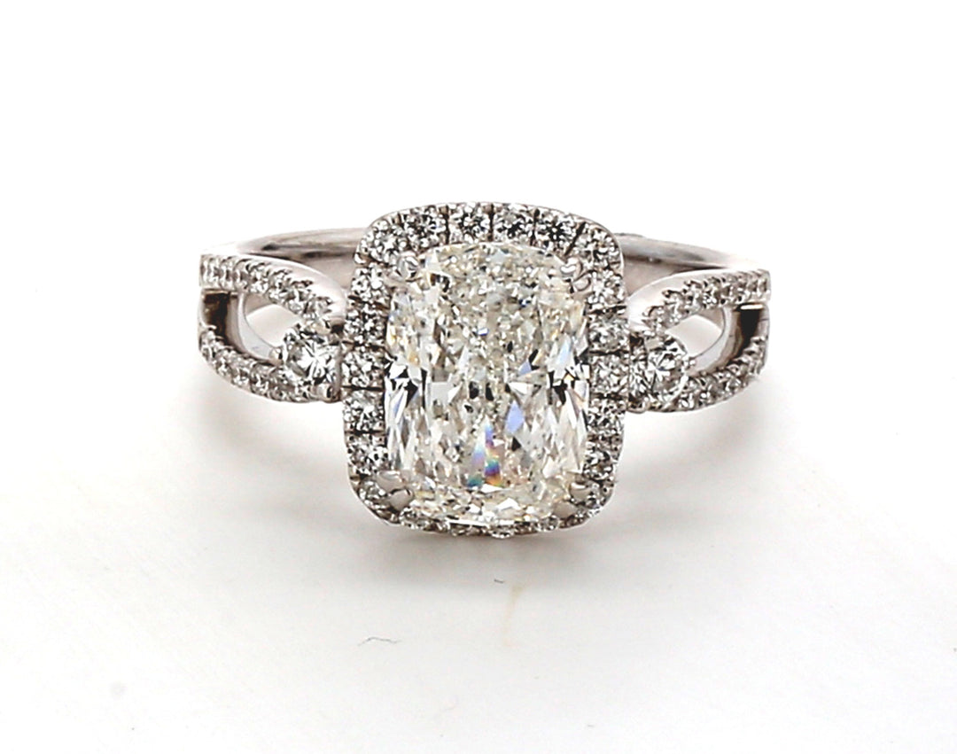 Halo semi-mount in 18K WG w/ French pave set round diamonds.  D0.57ct.t.w.