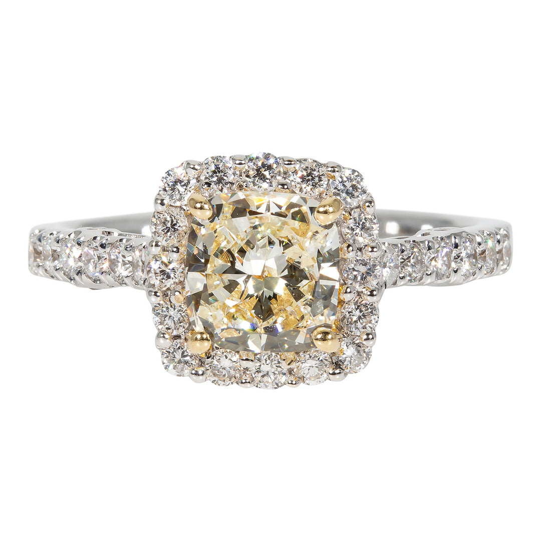 Halo ring in 18K WG with prong set rounds on shank and around FY cushion cut diamond center stone.  D1.70ct.t.w.  (Center 1.20ct.)  Size 6.75