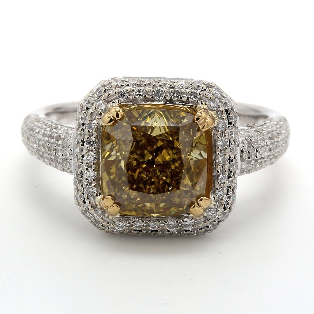 Halo ring in 18K WG with GIA certified FDBY/SI2 cushion center & french pave set round diamonds.  D3.59ct.t.w.  (Center 2.83ct.)