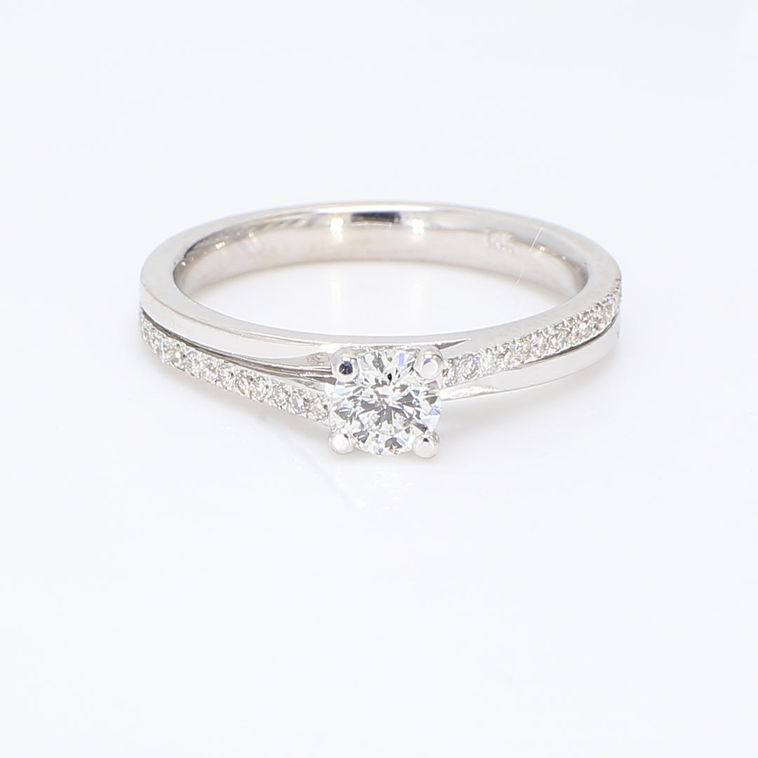 Ring with pave set rounds & 4-prong set round diamond center.  D0.52ct.t.w.  (Center 0.37ct.)