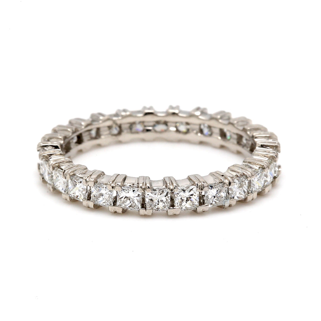 Eternity band in platinum with shared prong set (26) princess cut diamonds.  D1.47ct.t.w.