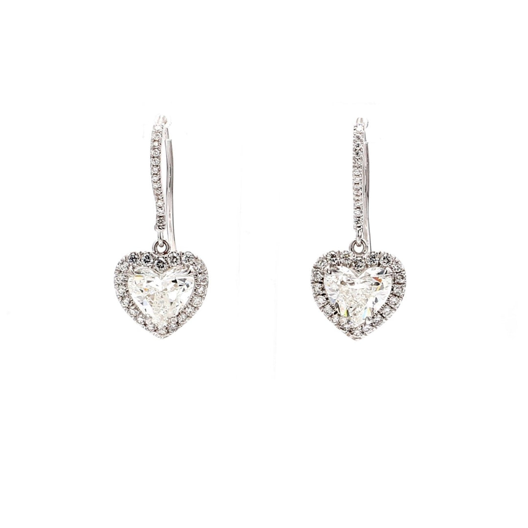 Halo dangling earrings in 18K WG with U-prong set rounds around claw prong set GIA certified G-H/SI1-SI2 heart shape diamond centers.  D3.60ct.t.w.