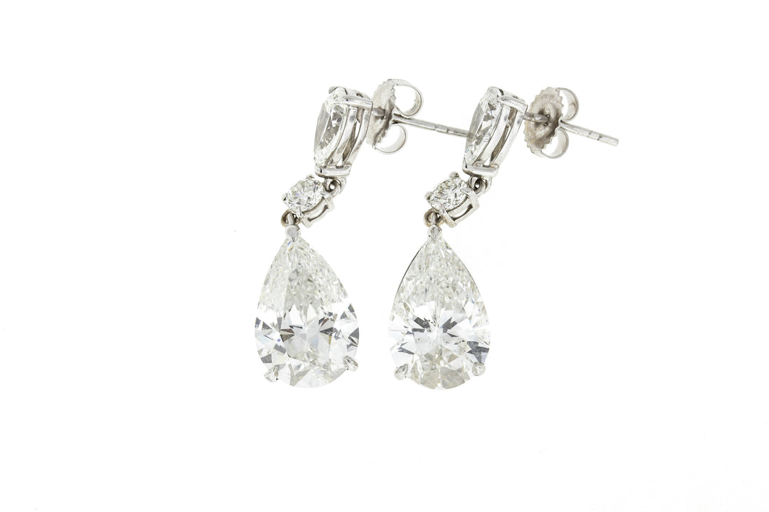 Dangling earrings in 18K WG with 3-prong set GIA certified I/VS2-SI1 pear shapes and 4-prong set round diamonds.  D8.25ct.t.w.