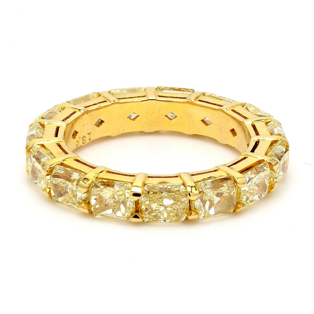 Eternity band in 18K YG with fancy yellow radiant cut diamonds.  D6.29ct.t.w.