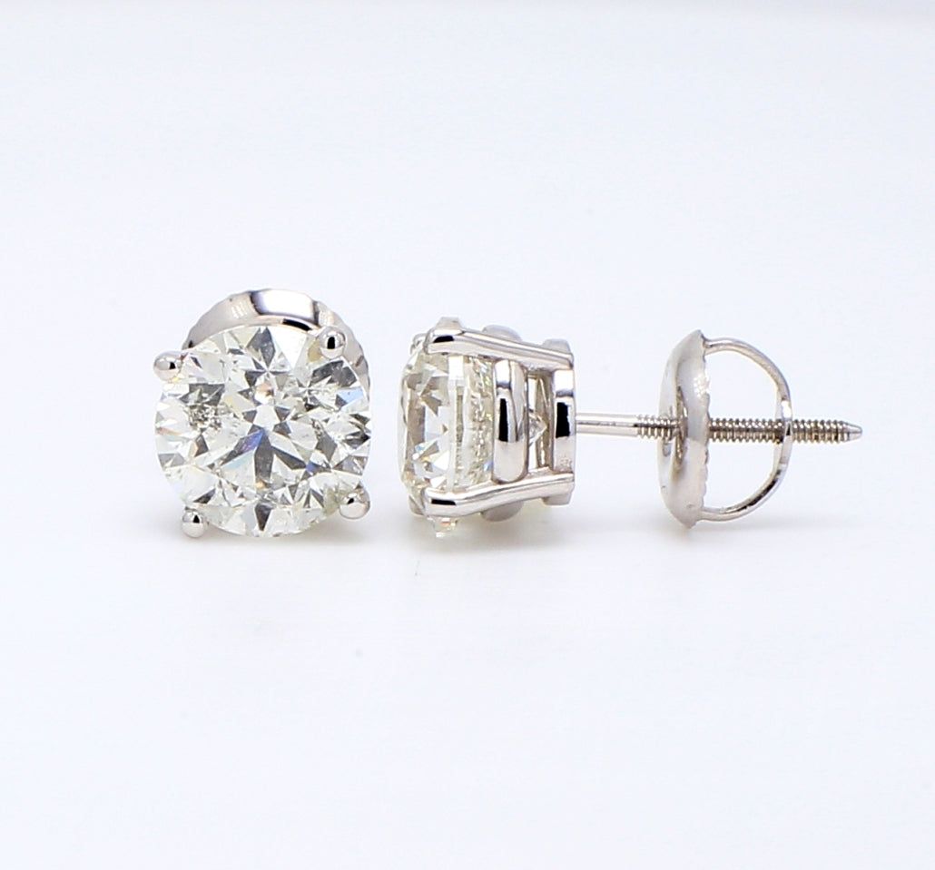 Screw back stud earrings with 4-prong set USA certified H/SI3 round diamonds.  D2.90ct.t.w.