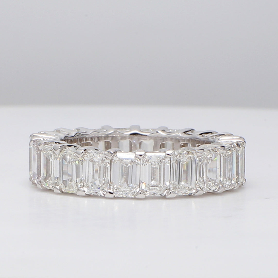 Eternity band with shared prong set (22) emerald cut diamonds.  D7.15ct.t.w.  Size 7