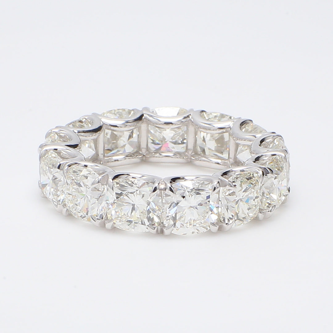 Eternity band in platinum with C-set I-J/VS-SI (13) cushion cut diamonds.  D9.44ct.t.w.  Size 6