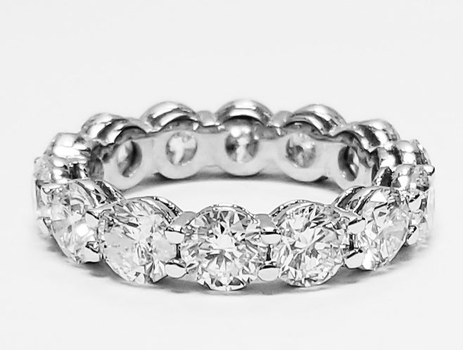 Eternity band with shared prong set (14) round diamonds.  D4.40ct.t.w.