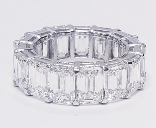 Eternity band in platinum with shared  prong set white/VVS (15) emerald cut diamonds.  D11.99ct.t.w.  Size 5