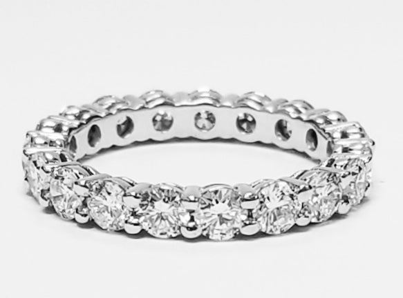 Eternity band in platinum with shared prong set (19) round diamonds.  D1.89ct.t.w.  Size 5