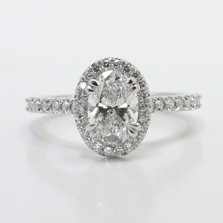 Halo semi-mount with shared prong set round diamonds.  D0.78ct.t.w.  Size 6.75