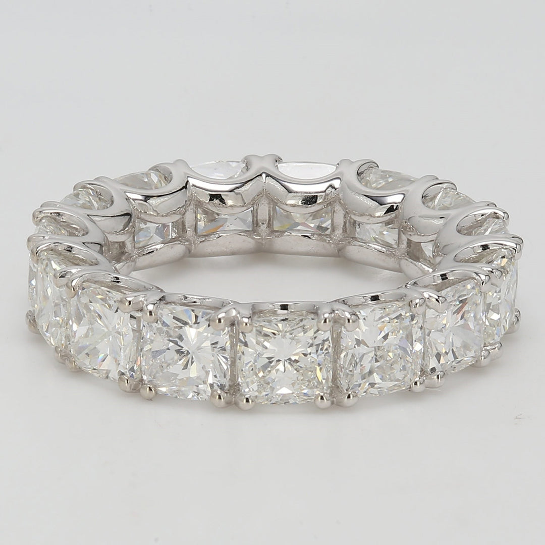 Eternity band in platinum with U-prong set G/SI1 (15) cushion cut diamonds.   D7.34ct.t.w.  Size 4.5