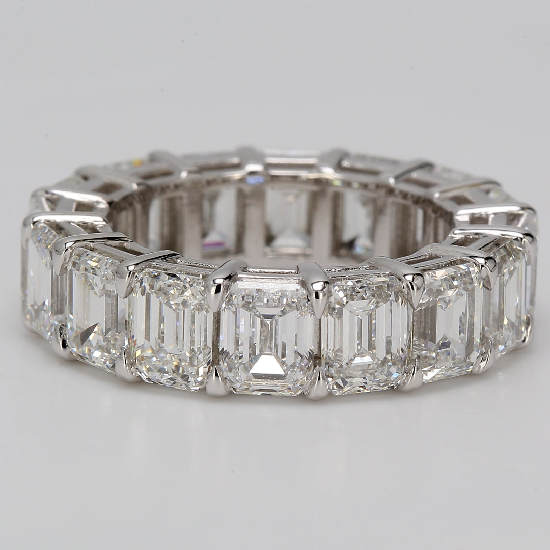 Eternity band in platinum with basket set GIA certified D-G/VVS (16) emerald cut diamonds.  D11.65ct.t.w.  Size 6.75