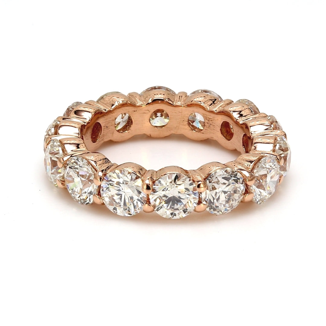 Eternity band in 18K RG with shared prong set round diamonds.  D4.63ct.t.w.