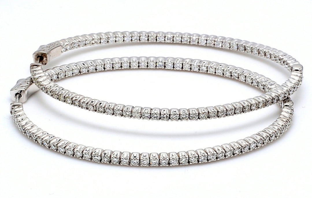 Inside out hoop earrings with 4-prong set round diamonds.  D2.97ct.t.w.