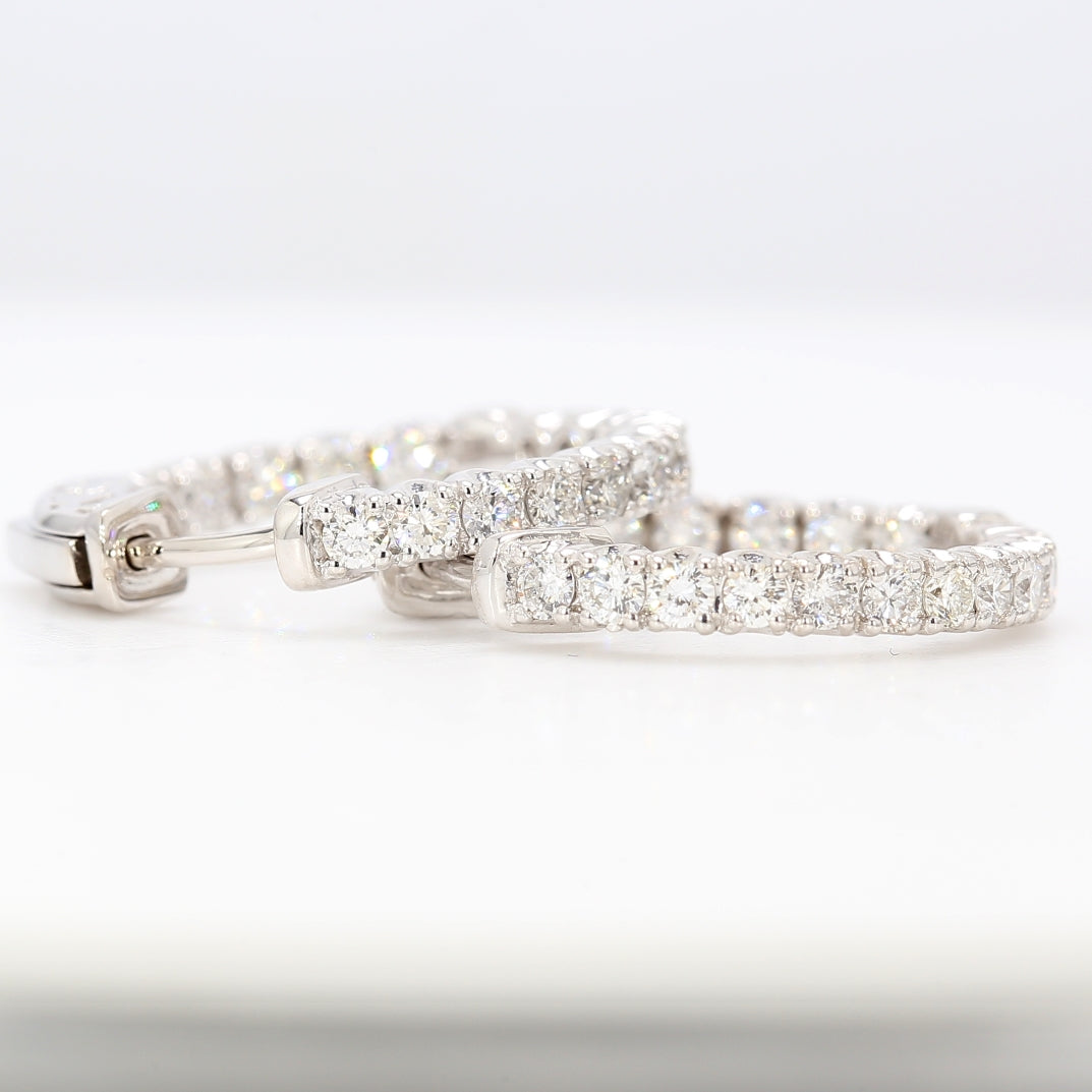 0.75"" Inside out hoop earrings with 4-prong set round diamonds.  D1.04ct.t.w.