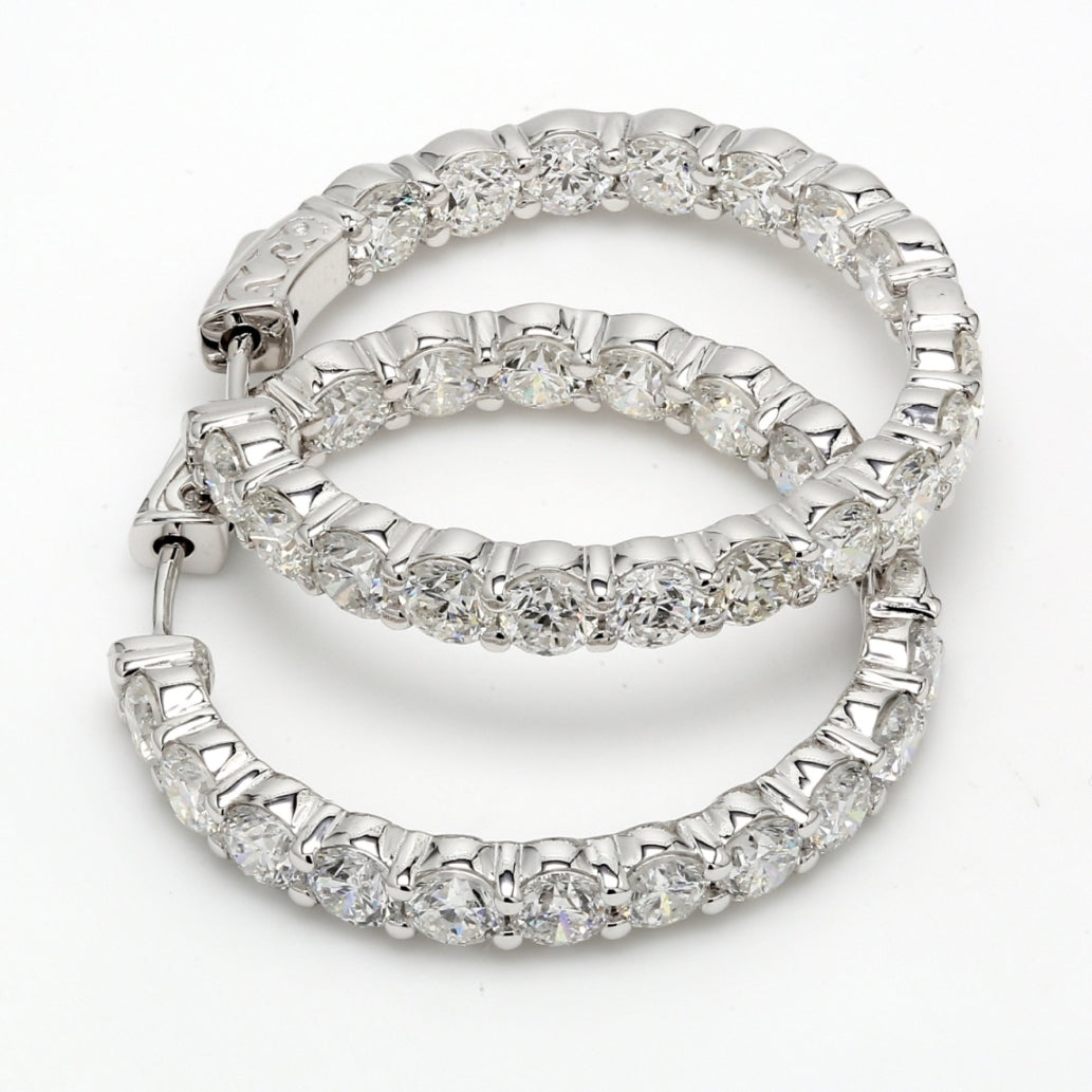 Inside out hoop earrings with shared prong round diamonds.  D8.47ct.t.w.