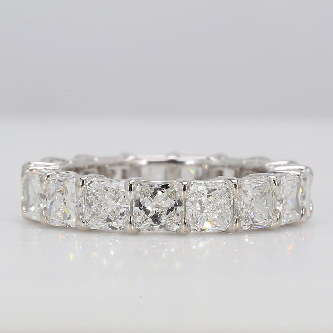 Eternity band in platinum with basket prong set F+/VS+ (17) square radiant cut diamonds.  D4.18ct.t.w.  Size 5.25