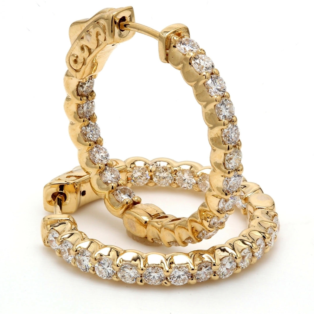 0.75"" Inside out hoop earrings in yellow gold with shared prong set (38) round diamonds & with special spring lock.  D1.46ct.t.w.