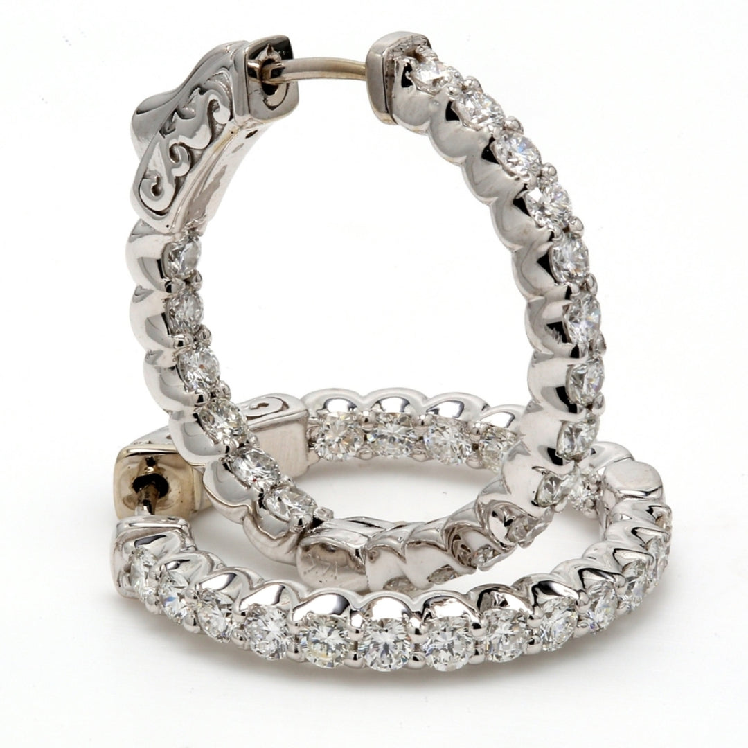 0.75"" Inside out hoop earrings with shared prong set (38) round diamonds & with special spring lock.  D1.45ct.t.w.