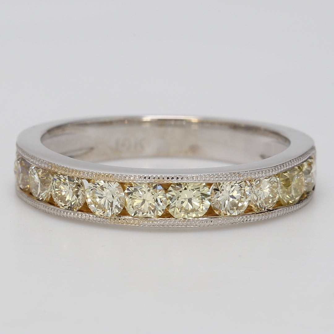 Band with milgrain on the sides & channel set fancy light yellow round diamonds.  D1.65ct.t.w.