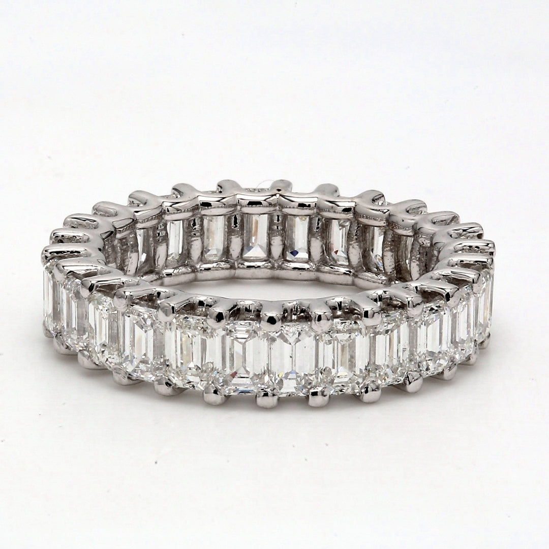 Eternity band in 18K YG with U-prong set (26) emerald cut diamonds.  D4.22ct.t.w.  Size 5.25