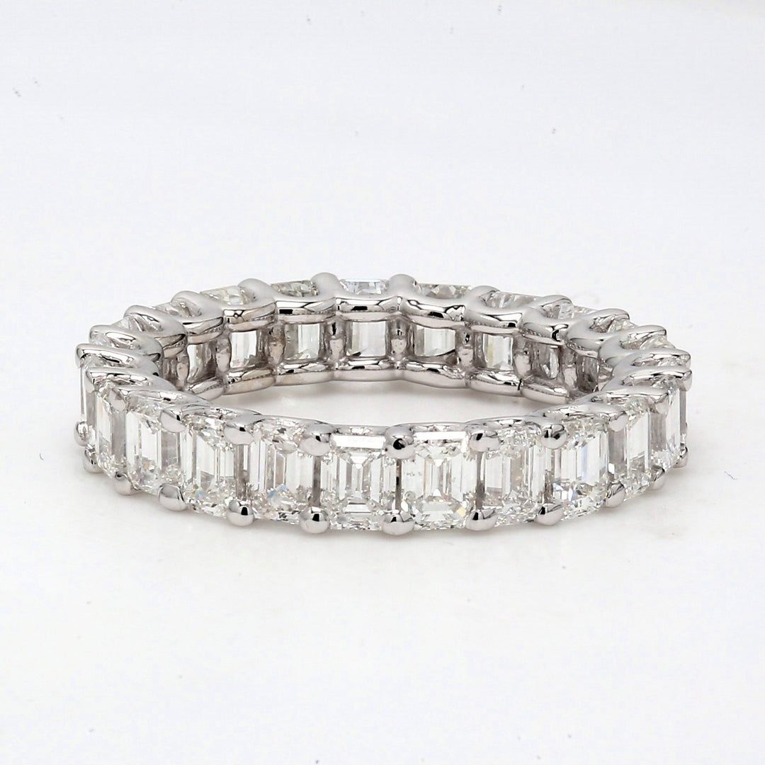 Eternity band with shared U-prong set (23) emerald cut diamonds.  D3.44ct.t.w.  Size 5