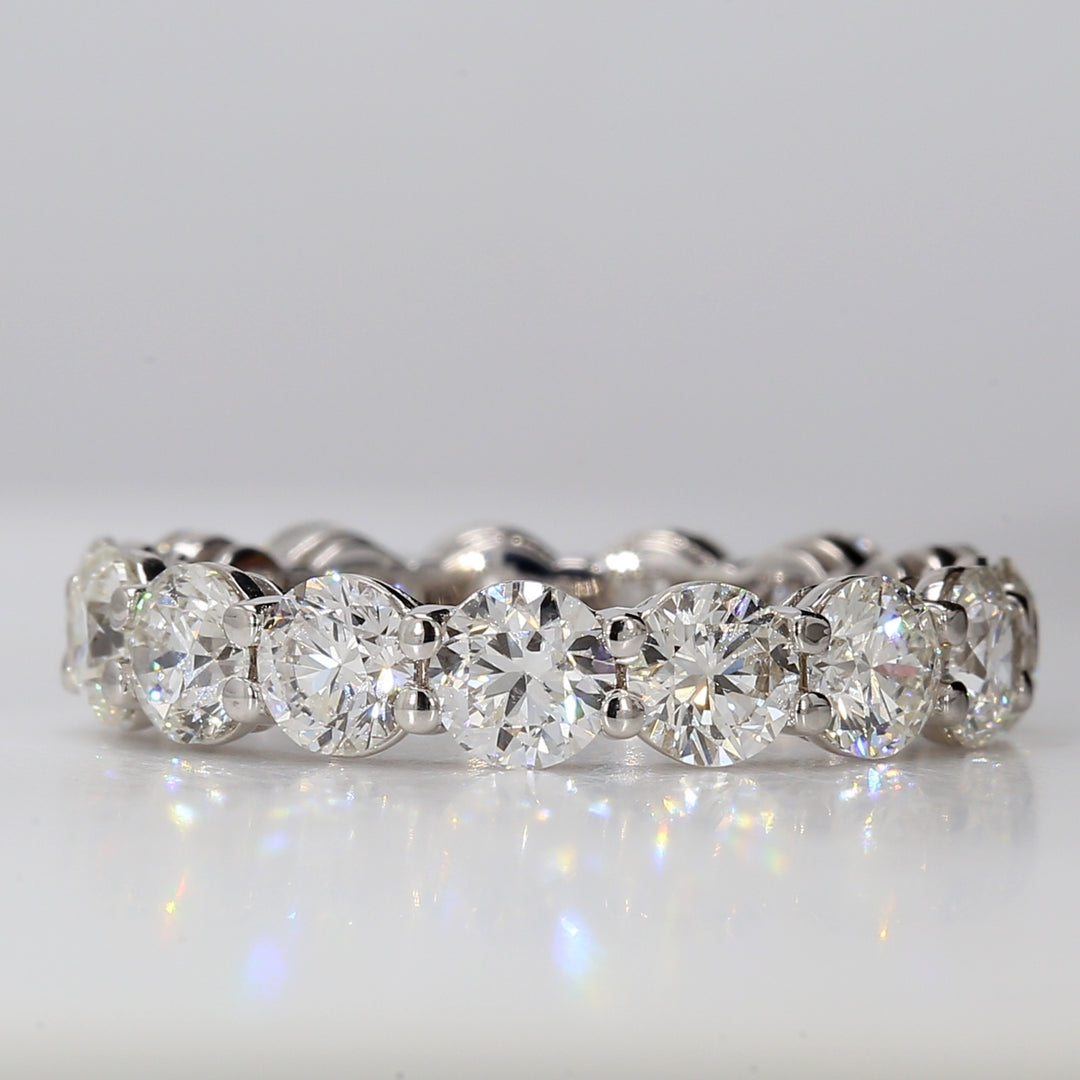 Eternity band in 18K WG with shared prong set F/VS (15) round diamonds.  D4.00ct.t.w.  Size 6