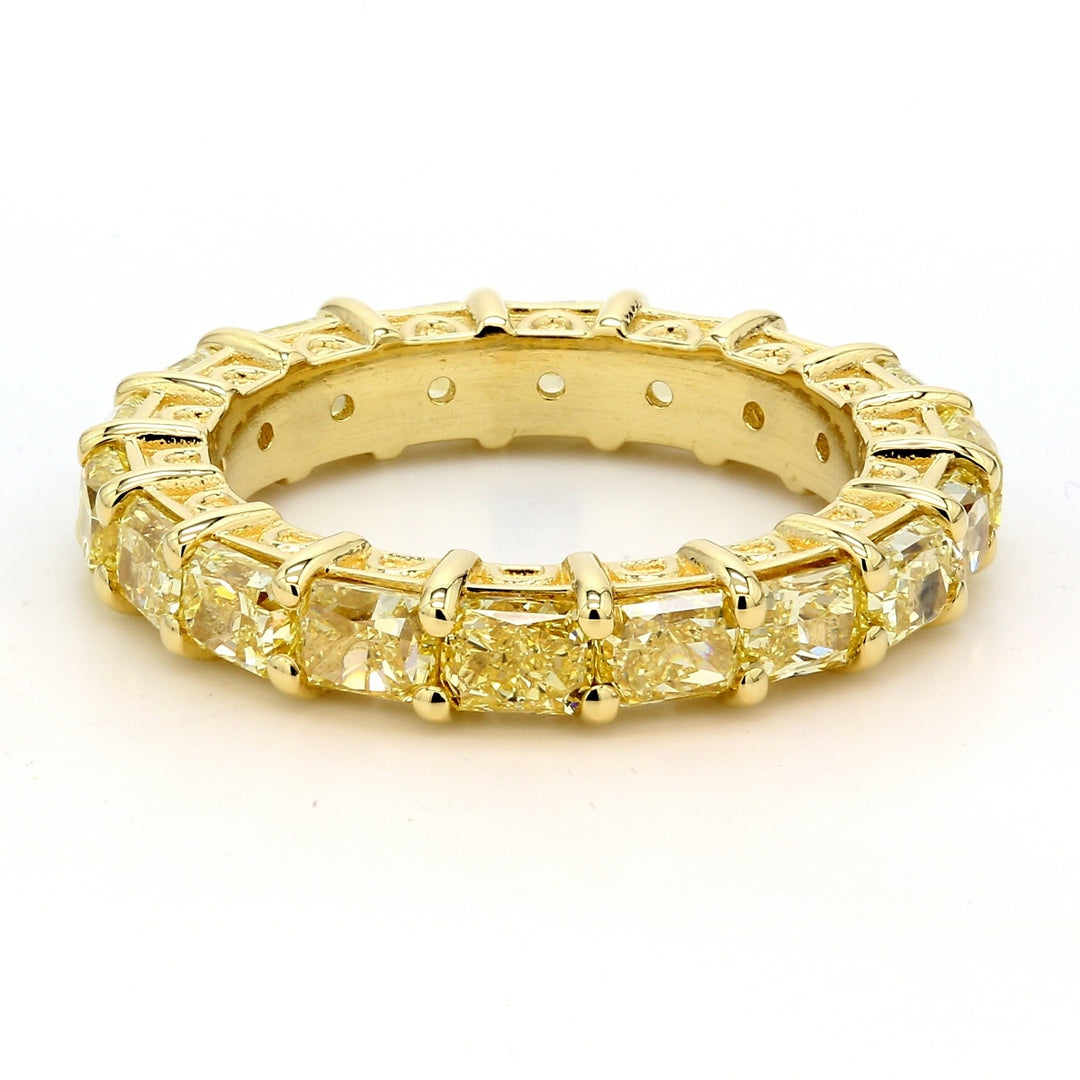 Eternity band in 18K YG with 4-prong set (18) fancy yellow radiant cut diamonds.  D4.45ct.t.w.  Size 6.25