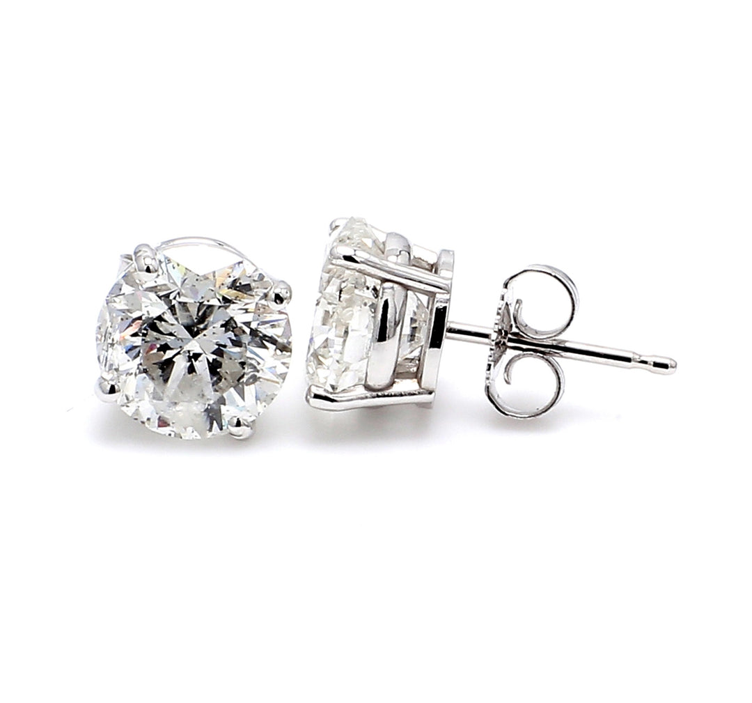 Push back stud earrings with 4-prong basket set round diamonds.  D0.48ct.t.w.