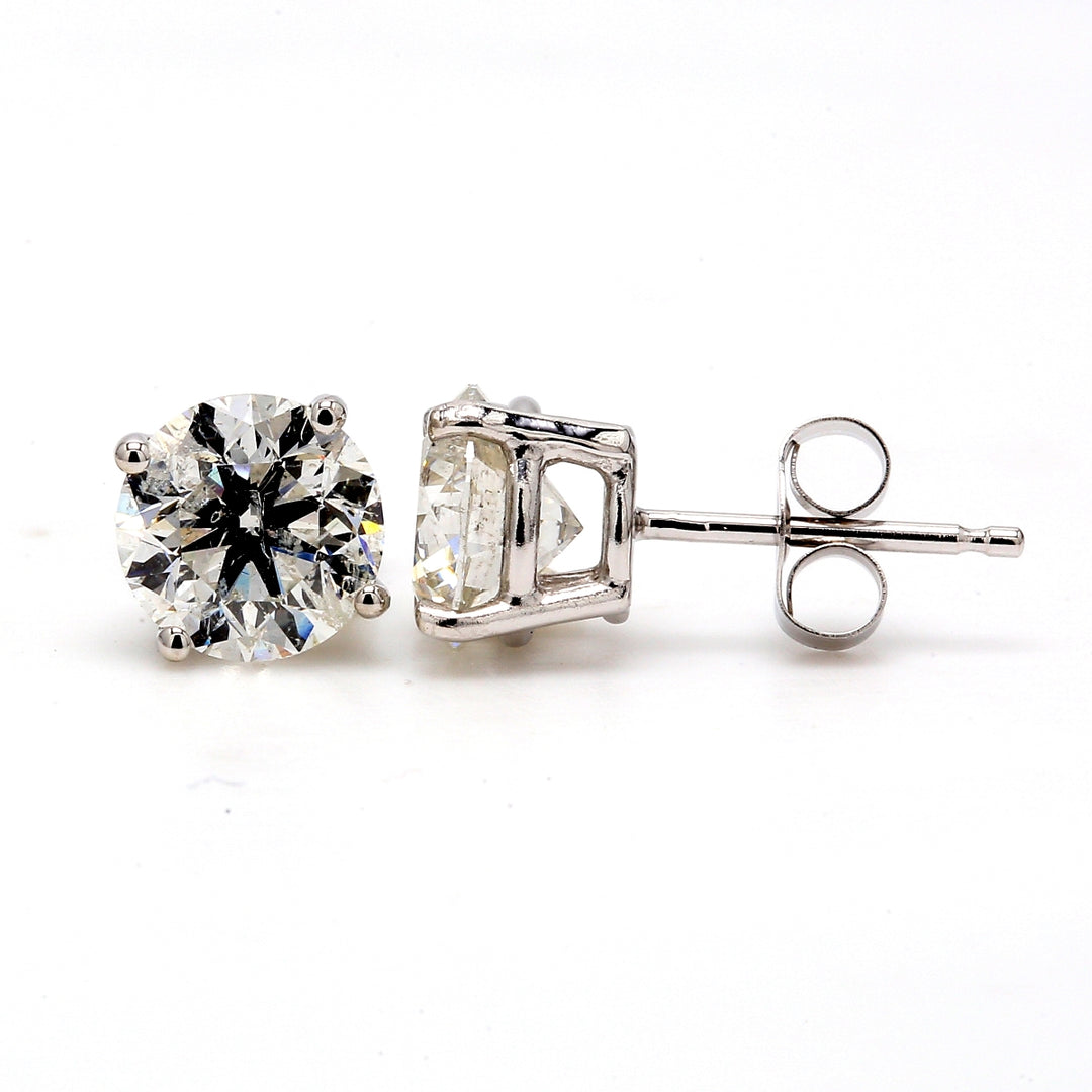 Push back stud earrings with 4-prong set round diamonds.  D2.18ct.t.w.