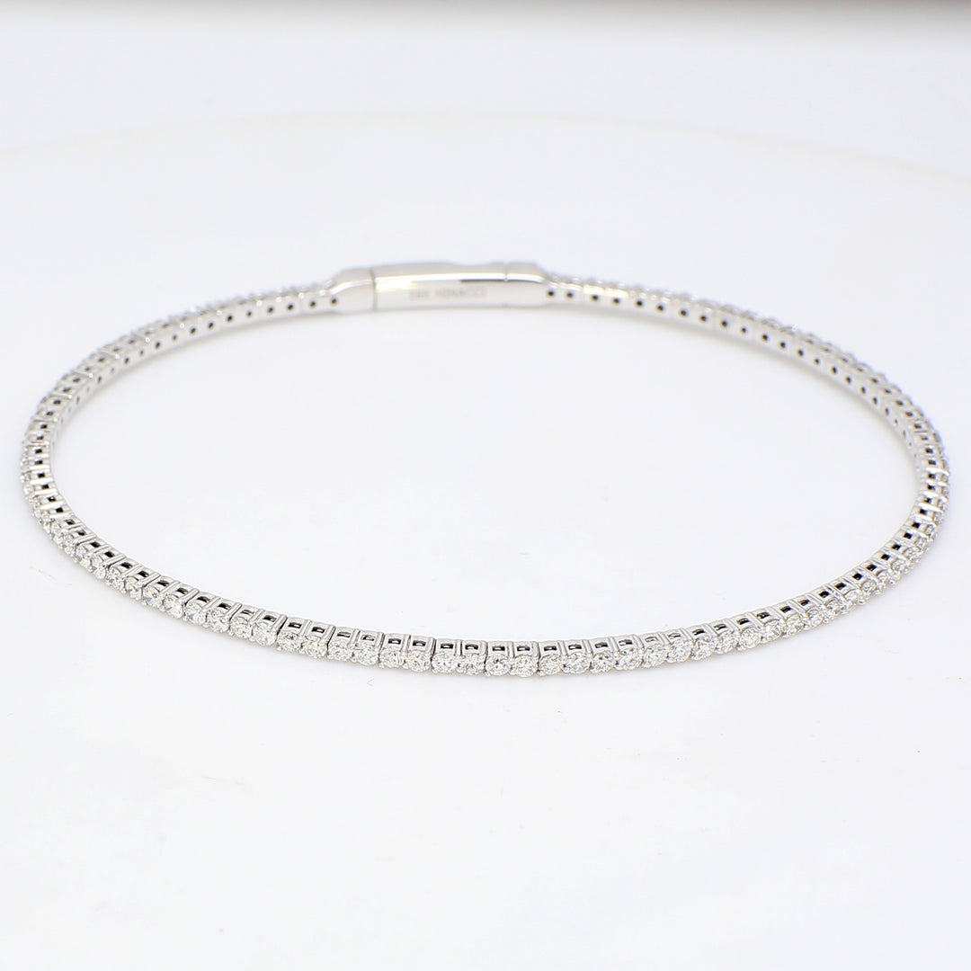 Flexible oval shaped eternity bangle in 18K WG with french pave set round diamonds.  D1.64ct.t.w.