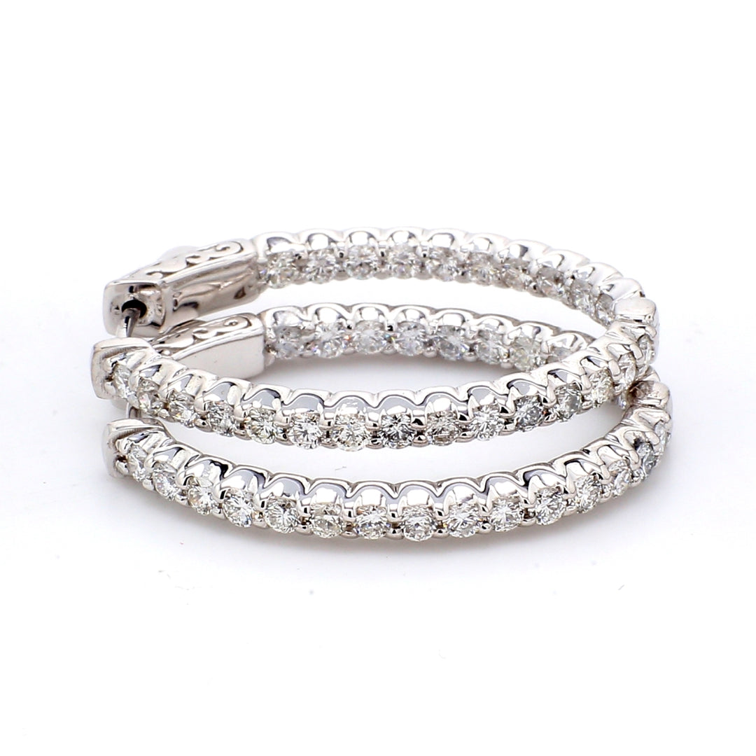 1.25"" Inside out hoop earrings with shared prong set round diamonds.  D1.92ct.t.w.