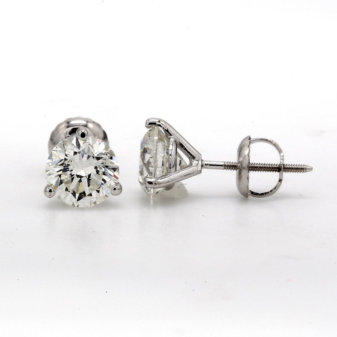 Screw back martini style stud earrings with prong set USA certified D-E/SI3-I1  round diamonds.  D2.34ct.t.w.