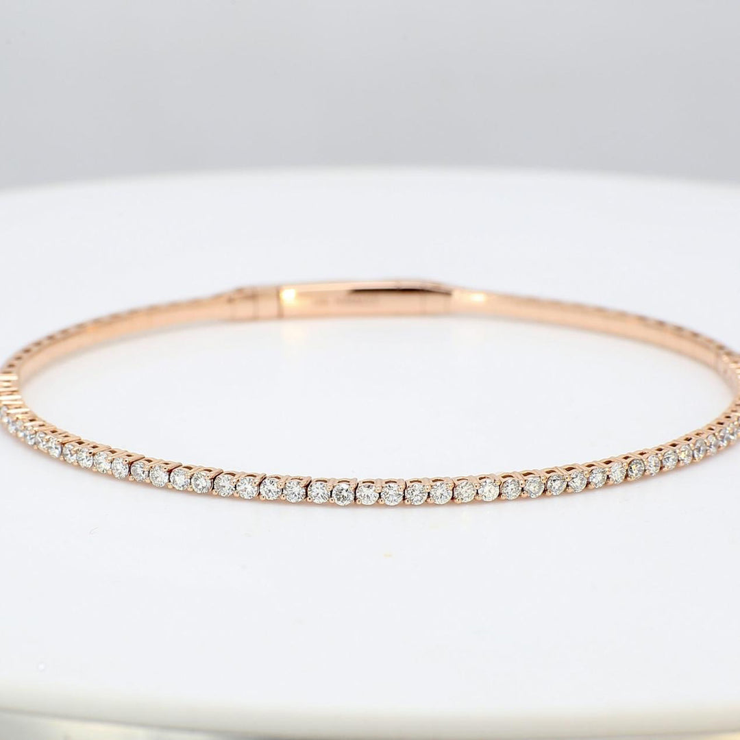 6.75"" Lightweight flexible oval shaped bangle in 18K RG with prong set round diamonds.  D1.02ct.t.w.