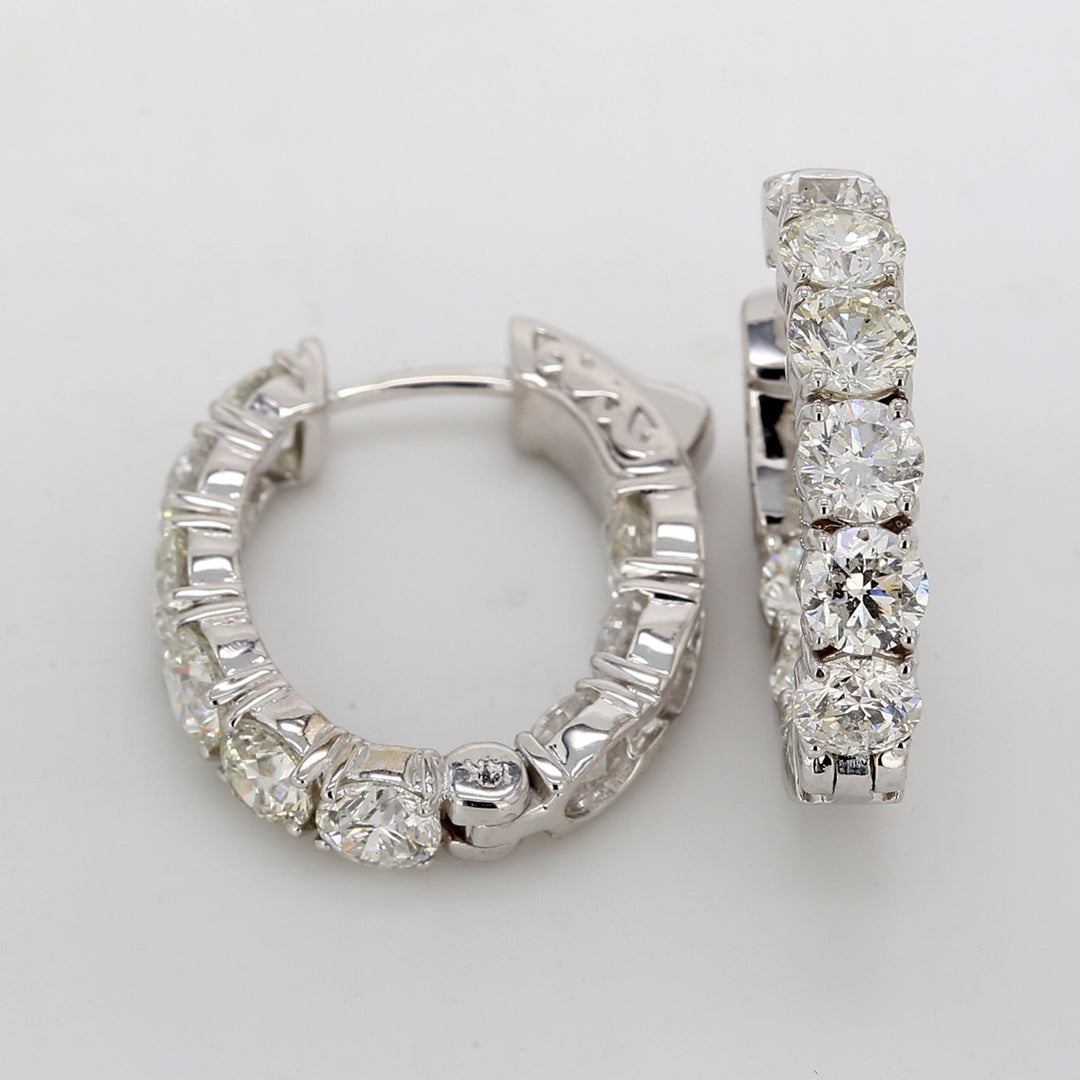 0.75"" Oval shaped inside out hoop earrings with shared prong set round diamonds.  D5.40ct.t.w.