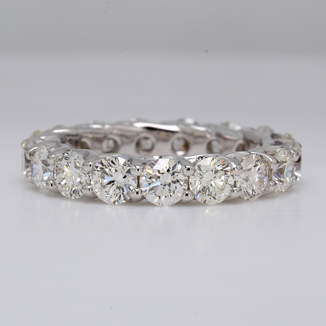 Eternity band in 18K WG with lucida style shared prong set round diamonds.  D3.92ct.t.w.  Size 6.25