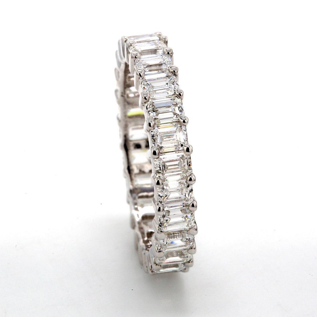 Eternity band with shared prong set (25) emerald cut diamonds.  D2.68ct.t.w.  Size 6