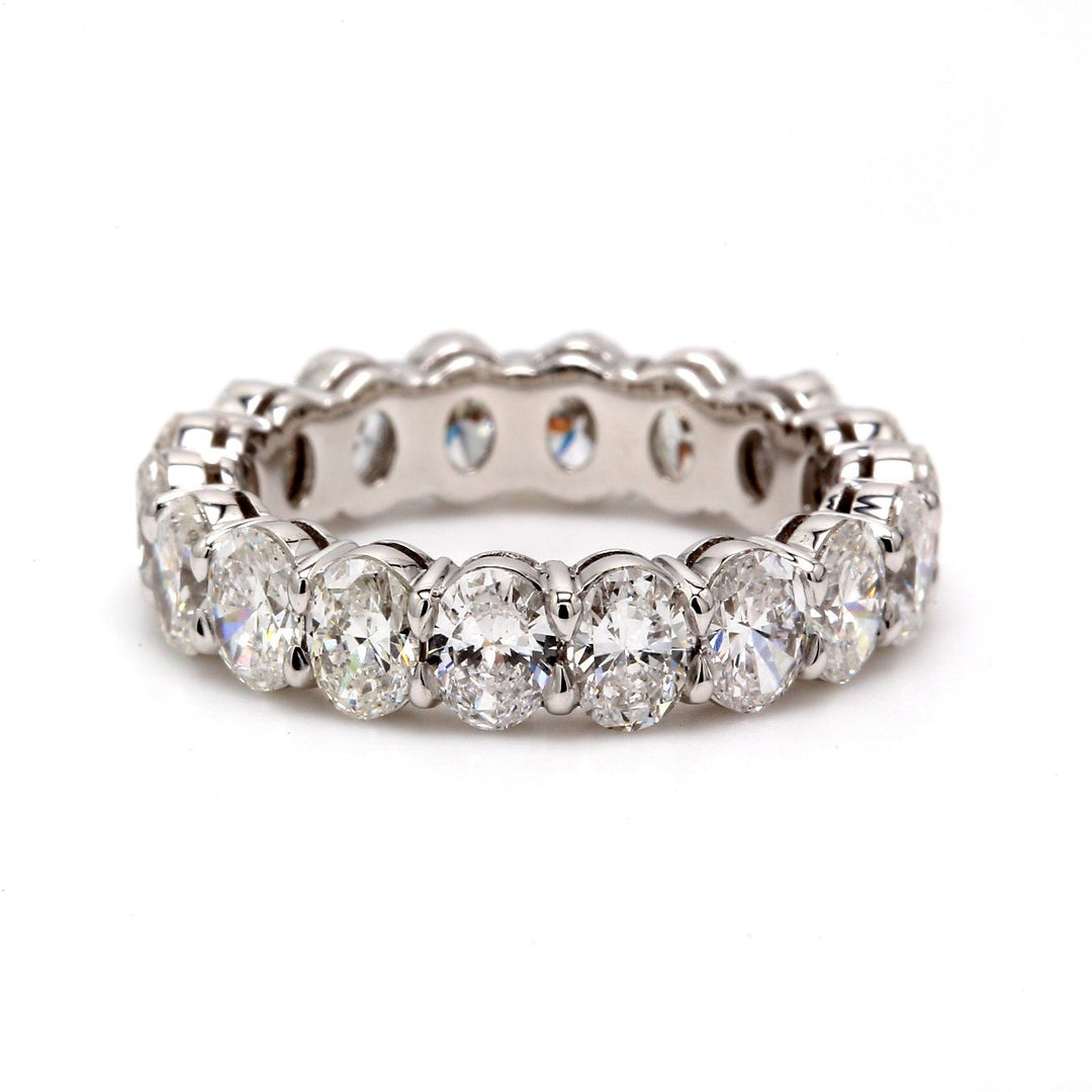 Eternity band in platinum with shared prong set E-F/VS1-VS2 oval diamonds.  D3.38ct.t.w.