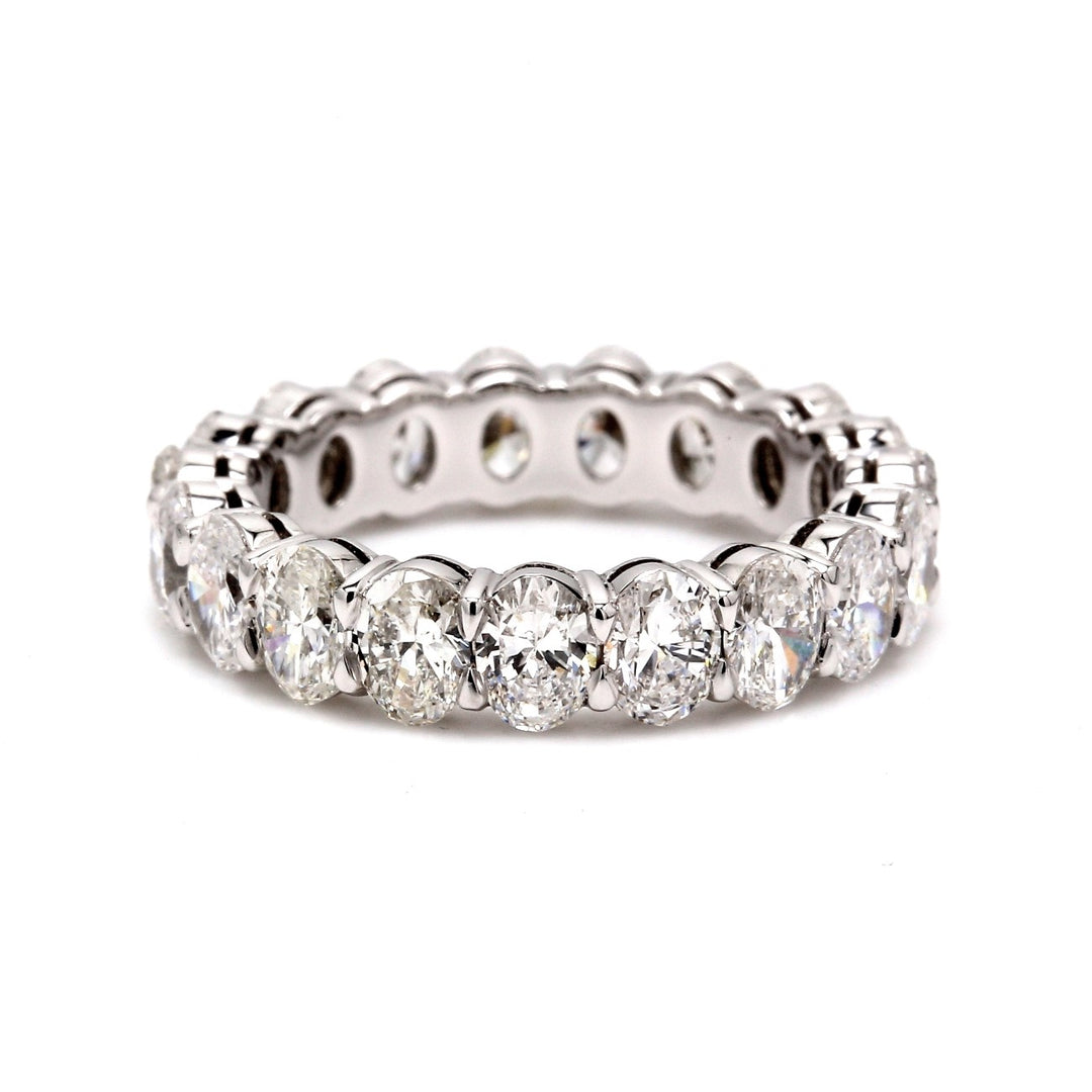 Eternity band in platinum with shared prong set E-F/VS1-VS2 oval diamonds.  D3.63ct.t.w.