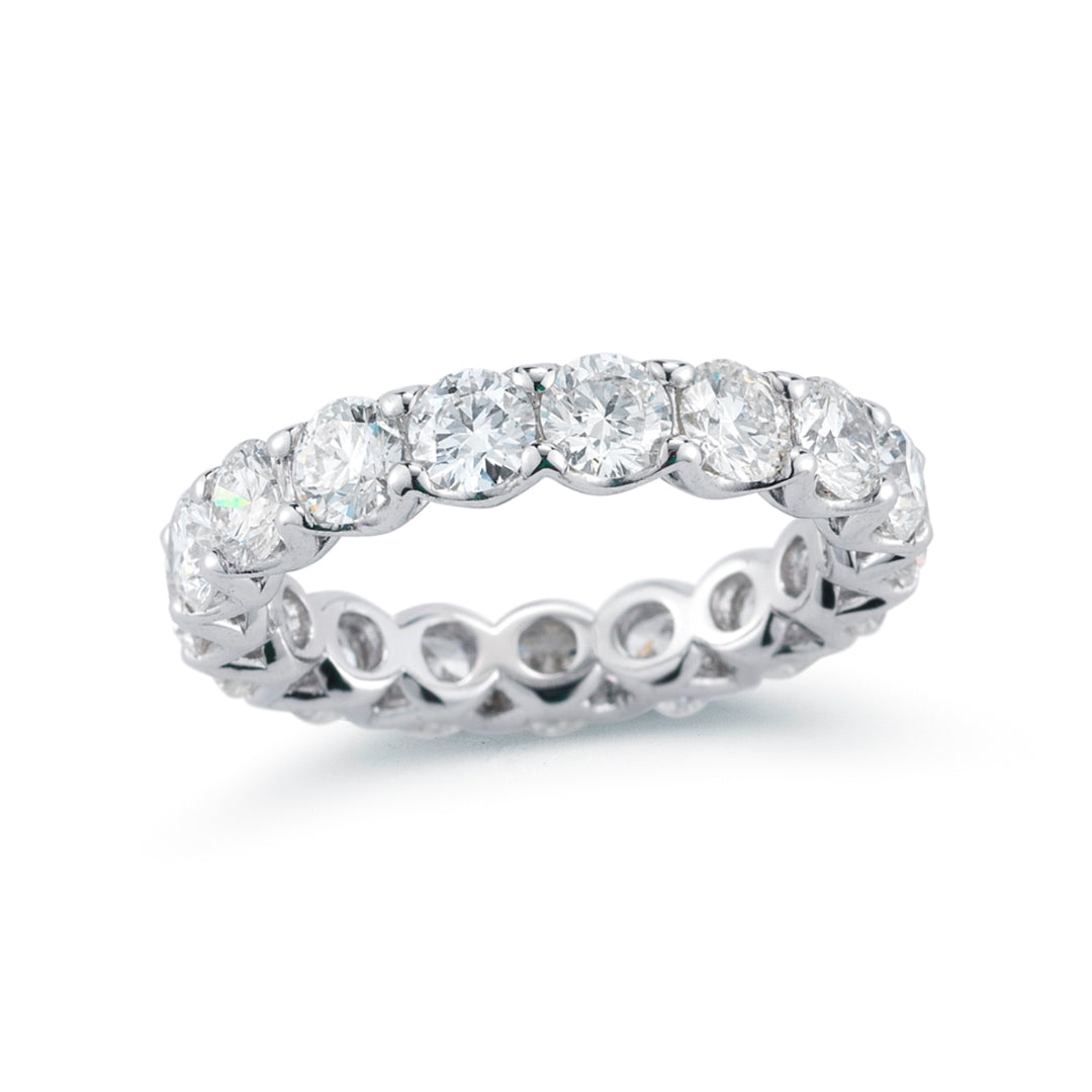 Eternity band in platinum with shared prong set GIA certified E-F/VS1-VS2 (13) round diamonds.  D9.10ct.t.w.  Size 6.5