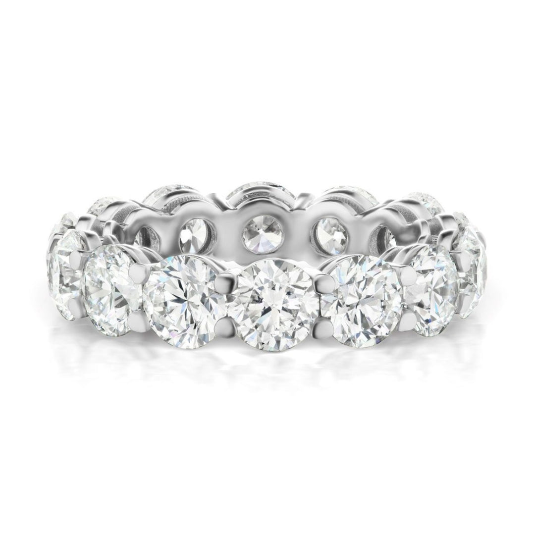 Eternity band in platinum with shared prong set GIA certified I/SI1 (14) round diamonds.  D7.11ct.t.w.  Size 7