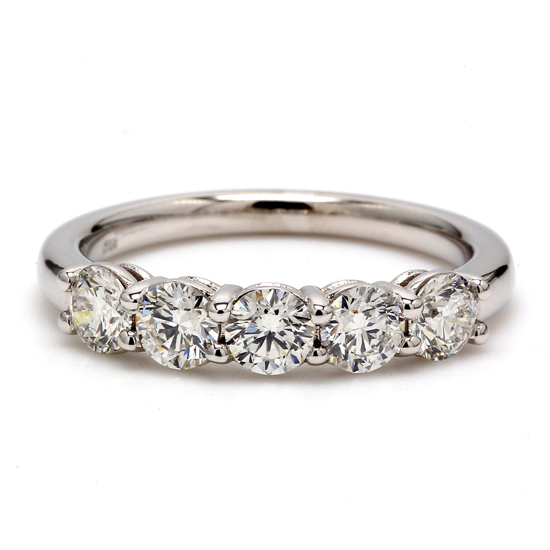 5-stone band with shared prong set round diamonds.  D0.79ct.t.w.  Size 6.25